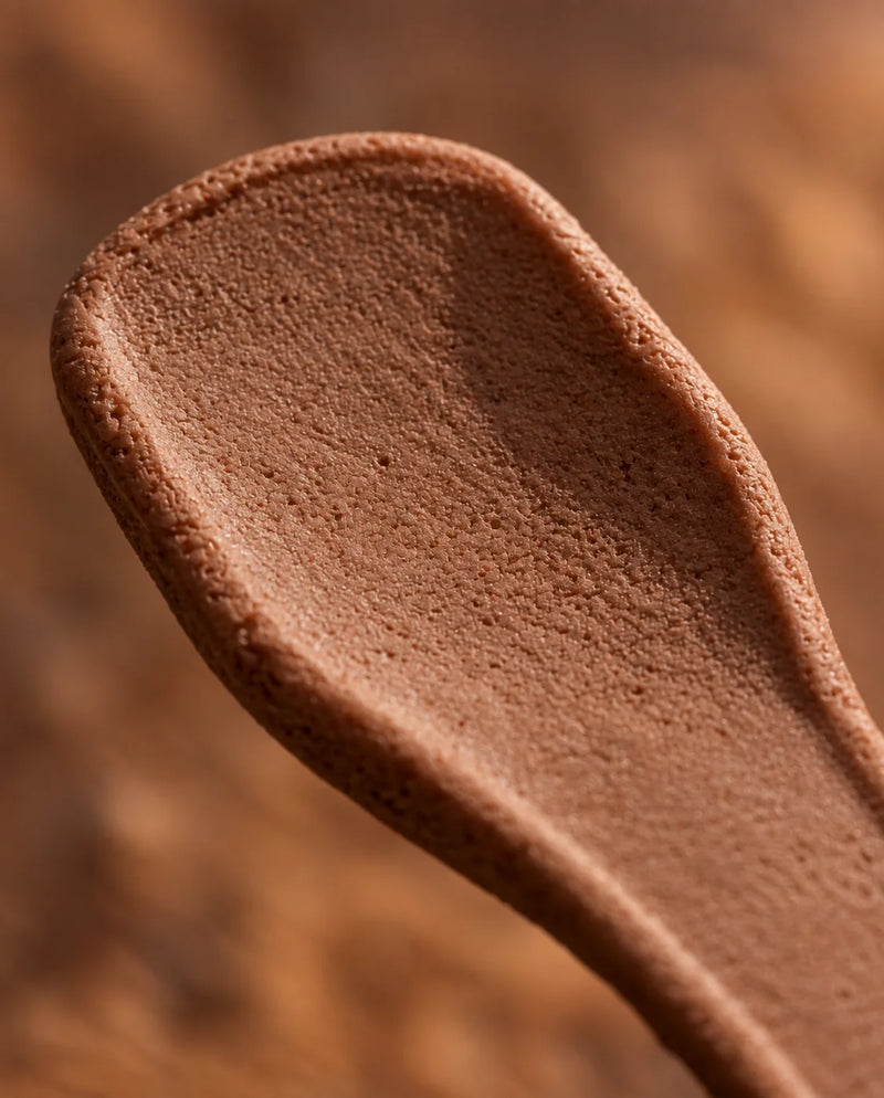 Close-up of a Chocolate Hazelnut Double Dip Chips edible spoon showing its crisp texture