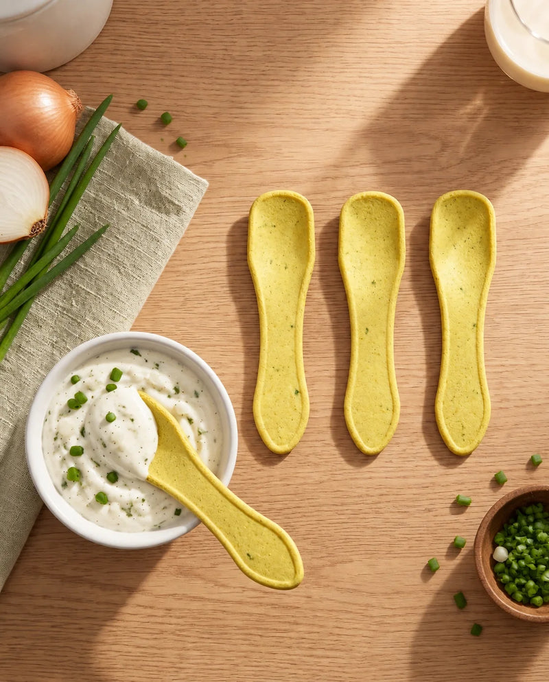Three Double Dip Chips Sour Cream & Onion edible spoons beside a bowl of sour cream dip with chives