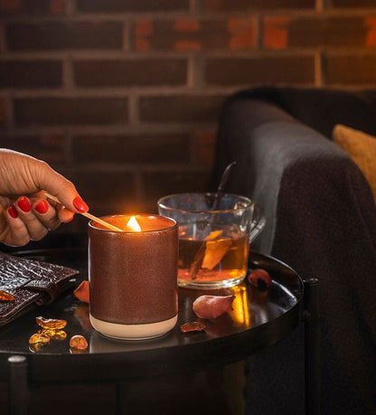 Scented candle in ceramic jar